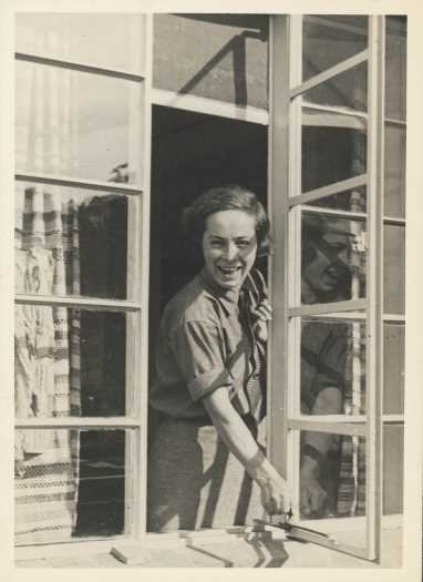 Patience Tillyard opening or closing a troublesome window at The Spinney