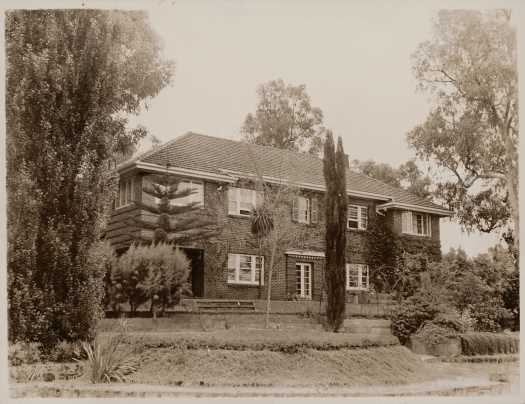 Front view with well established garden.