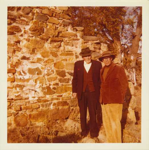 Messrs. W. Ryan and L. Young standing beside an old stone building wall. CDHS excursion 29 May 1976.