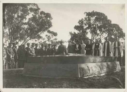 Close up to General Bridges' grave surrounded by clergy and senior Army officers. He was buried on 3 September 1915.