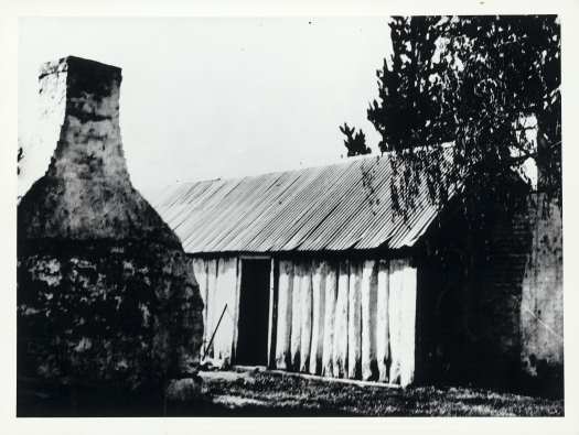 Slab hut with chimney of old kitchen.