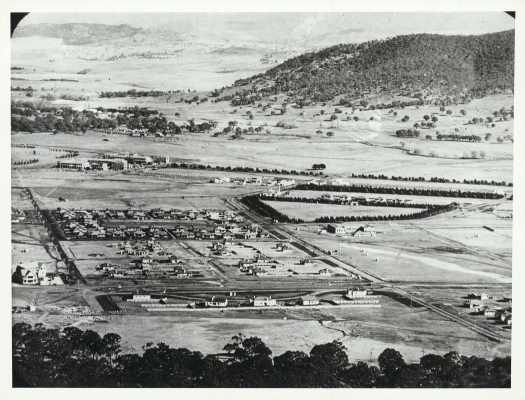 Also shows Northbourne Oval (surrounded by trees), Civic and Black Mountain.