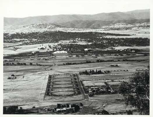 Shows the Australian War Memorial under construction and Anzac parade.