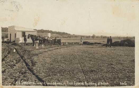 Horse and cart, small hut.