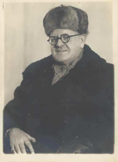 Shows Joe Alexander dressed for a cold Moscow winter.