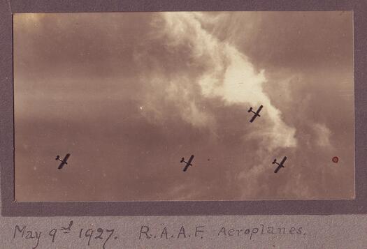 Four aeroplanes flying overhead at the opening of Parliament House on 9 May 1927