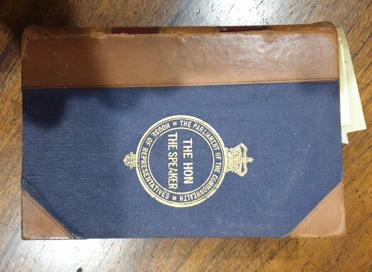 Leather spine copy embossed on front cover with 'The Hon Speaker' on the front cover.