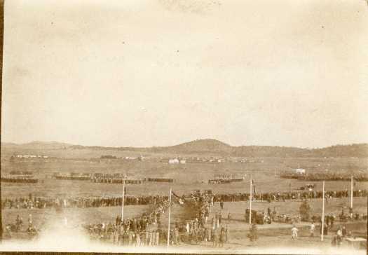 Crowds gathered for opening of Provisional Parliament. Manuka and Hotel Wellington in background. Looking south east.