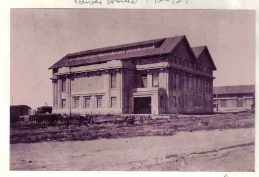 Completed Power House with light rail tracks and side loading brick trucks.
