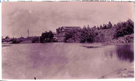 Taken from the weir. Shows four quite large houses to left of the Power House built c 1914.