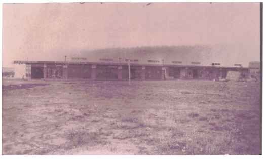Shows the first block of shops built at Kingston including JB Young on left corner.