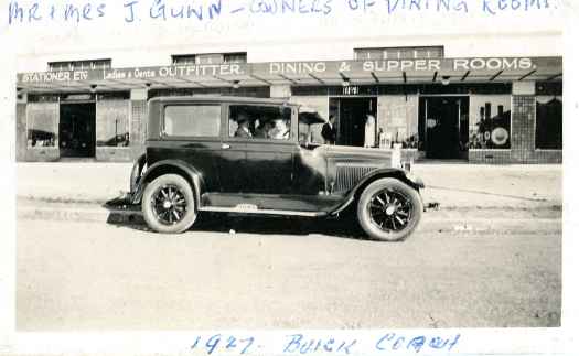 Back of photo reads ' May and John Gunn outside their Eastlake shop 'Southern Cross Tearooms'. They moved in there in 1926.'