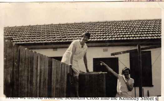 Shows Florie climbing fence.