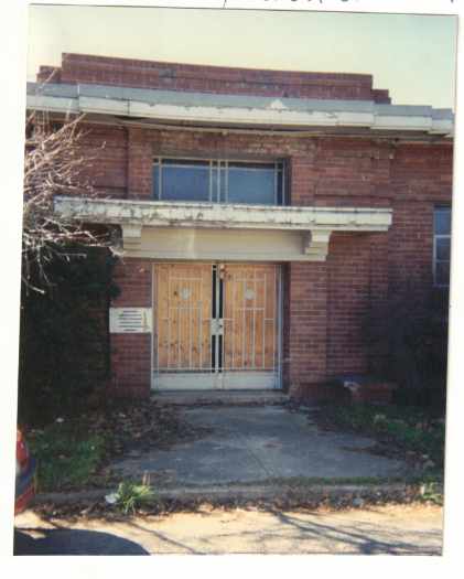 Entrance boarded up.