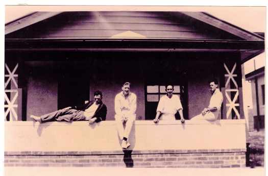 On a verandah are Benson, Munce, Dunlop and Curnow.