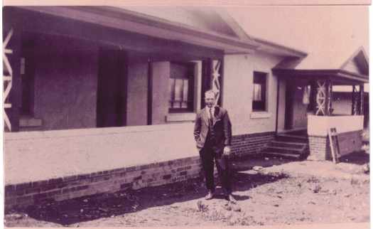 Alf Roberts, Printer, standing in front of building. Alf was Chas Chandler's brother-in-law.