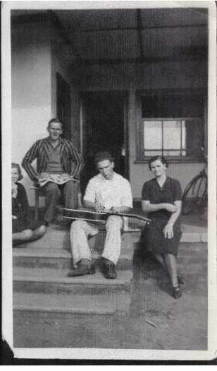 Four people on back steps of Kingston guest house cottage including Myrtle Warry who worked in the dining room.