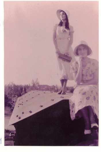The two girls are well dressed. Looking towards the Power House.