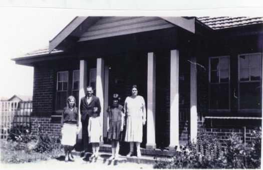 Family standing outside house on corner of Giles and Tench Streets, Kingston c1929.